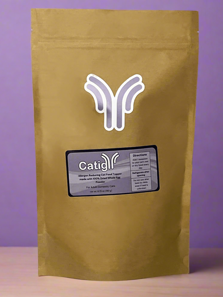 Gold-colored kraft packaging with a brand logo on a purple background